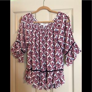 Cute, colorful top with crochet detail.